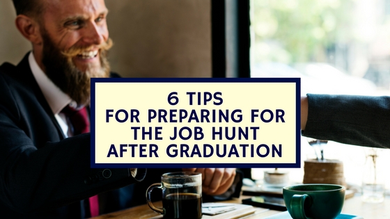 Two people sitting at a table, shaking hands, one man smiling, image used for Nicholas Fainlight blog post about how to prepare for job searching after graduation